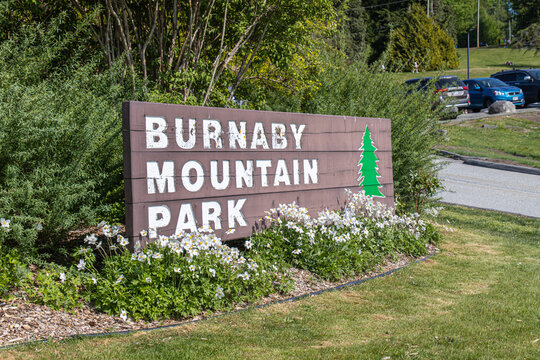 Vancouver, CANADA - May 14 2023 : Burnaby Mountain Park sign seen in sunny day.
