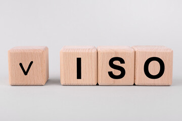 International Organization for Standardization. Wooden cubes with check mark and abbreviation ISO...