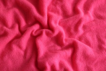 Beautiful pink fabric as background, top view