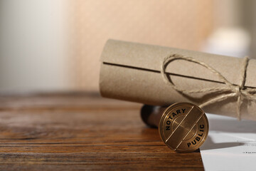 Public notary. Documents and stamp on wooden table, closeup. Space for text