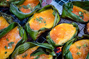Thai Grilled Egg (Kai Pam) in the Cups made from banana leaves. Thai Northern Style Food.