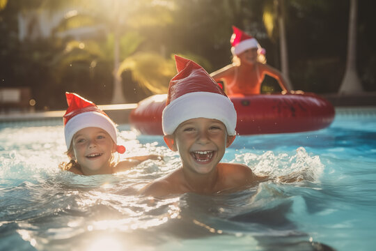 Little kids in a Santa hat and swimming around in the pool, the concept of celebrating Christmas and new year in tropical countries