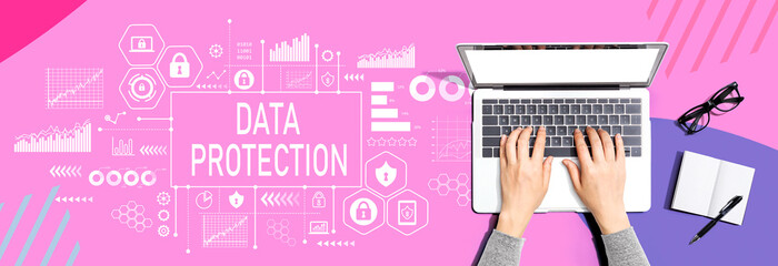 Data protection theme with person using a laptop computer