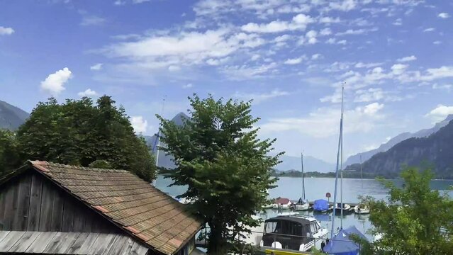 Panoramic View over Lake Thun and Mountain in a Sunny Summer Day in Bernese Oberland, Bern Canton, Switzerland. (Time Lapse)
