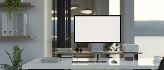 Modern office workspace with a white-screen PC computer mockup and office supplies on a white desk.