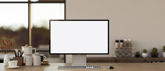 Cosy home workspace with a white-screen computer mockup and accessories on a wooden desk.