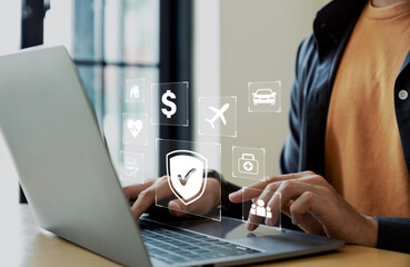 Businessman using laptop with insurance online for car, travel, financial and health insurance....