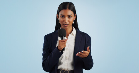 Woman, portrait or presenter in studio talking, speaking on talk show or media on blue background. Breaking news, tv press or Indian reporter presenting live global political events with microphone - obrazy, fototapety, plakaty