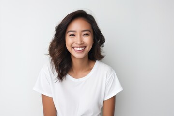 Young Asian woman smiling portrait white background - obrazy, fototapety, plakaty