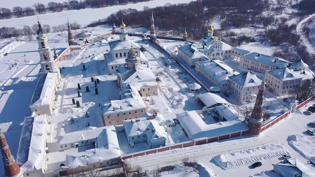 Aerial panoramic view of architectural complex of Epiphany Staro-Golutvin Monastery in ancient Russian city of Kolomna on sunny winter day