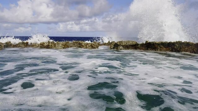 Pan shot of blow hole, Tinian island