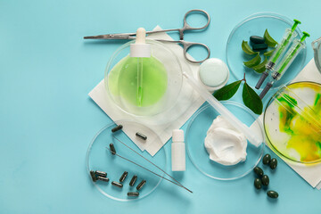 Cosmetic laboratory research on blue background. Beauty concept