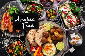 Middle eastern or Arabic different dishes on black background. Tasty traditional food concept