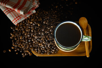 Obraz na płótnie Canvas Traditional Indonesian Coffee top angle on black background.