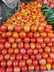 Exquisite red tomatoes freshly harvested and beautifully arranged, showcasing the vibrant colors and succulent texture, ideal for concepts related to agriculture, farm-fresh produce, healthy eating, c