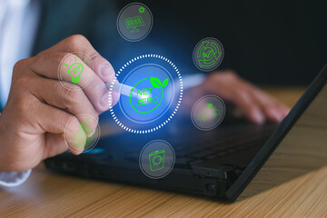 Businessman makes a computer report on the concept of renewable energy to reduce CO2 emissions,...