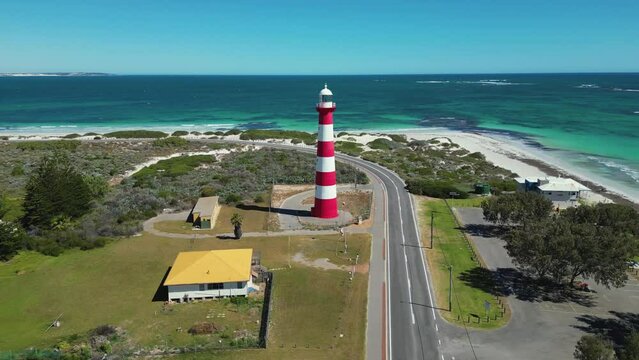 Red and white lighthouse on stunning turquoise coastline. Geraldton - Australia