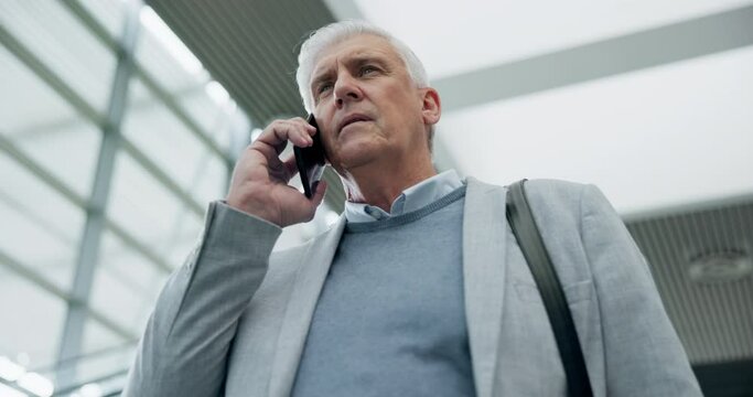 Escalator, phone call and business man in conversation, networking and travel in low angle. Smartphone, serious ceo and senior professional in airport for communication, chat or speaking to contact