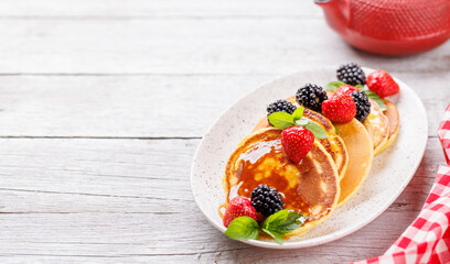 Tasty homemade pancakes with berries