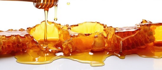 Glass bowl of honey with honey dipper on white background. - obrazy, fototapety, plakaty
