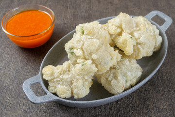 Cireng kuah seblak. indonesian food made from tapioca flour is given spices such as garlic, salt, pepper and is cooked by frying.