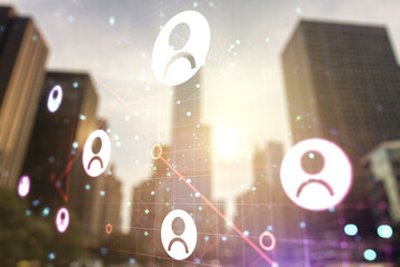 Double exposure of abstract virtual social network icons on modern skyscrapers background. Marketing and promotion concept