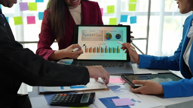 Startup business team meeting working on graph document and laptop new business project, Group of Business People Diverse Brainstorm Meeting Concept.
