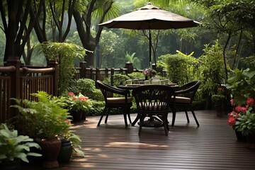 Design a tranquil outdoor scene featuring a rattan patio set placed on a wooden deck in a sunlit garden. - obrazy, fototapety, plakaty