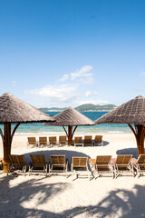 Beach lounges and umbrellas on the beach.