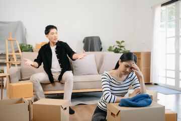 Divorce. Asian couples are desperate and disappointed after marriage. Husband and wife are sad, upset and frustrated after quarrels. family problem, teenage love. on sofa