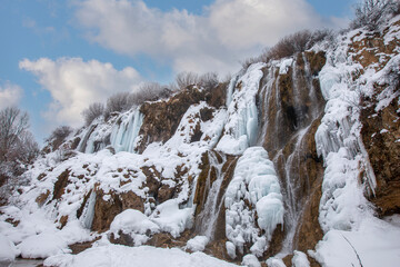 Fototapeta na wymiar Girlevik Waterfall. Winter season. Girlevik Village Caglayan Subdistrict, Erzincan, Turkey