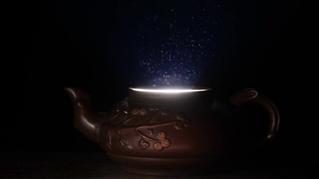 Light coming out of a clay teapot