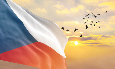 Waving flag of Czech Republic against the background of a sunset or sunrise. Czech Republic flag...