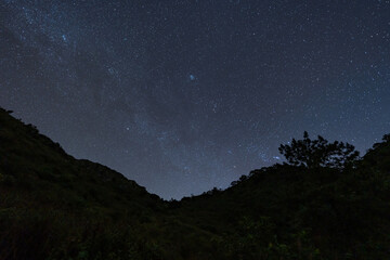 Night sky full of stars and tail of milky way from the top of Doi Luang Chiang Dao in Chiang Mai,...