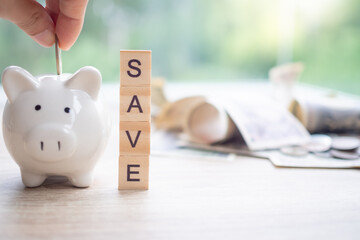 Save money. business woman putting coin into piggy bank for saving. wealth, Finance, business,...