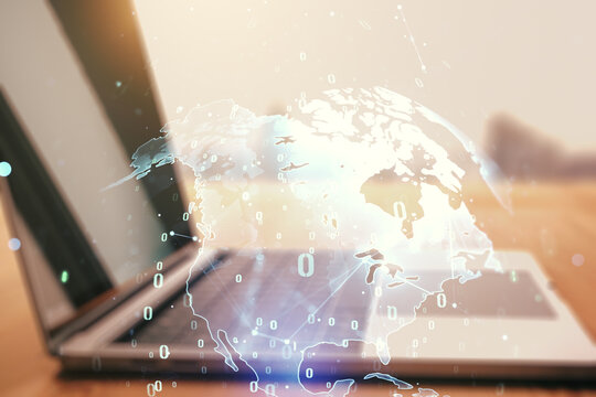 Multi exposure of abstract software development hologram with world map on laptop background, global research and analytics concept