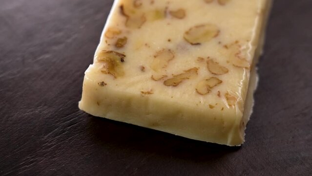 A bar of typical Spanish turron with almonds. Traditional Christmas treats in Spain. Rotation