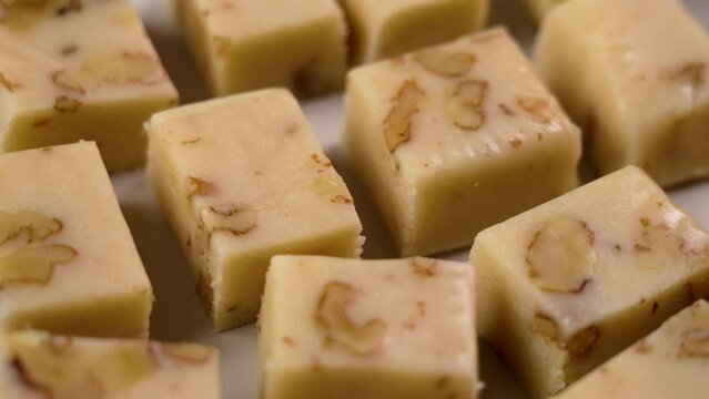 Typical Spanish turron with almonds. Sliced traditional Christmas treats in Spain. Rotation