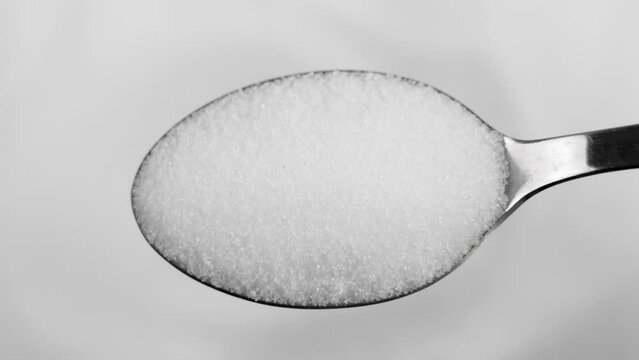 Herb stevia sugar in metal teaspoon. Natural healthy crystalline sweetener in powder close up