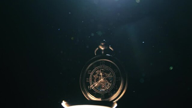 Pocket watch in a ray of light