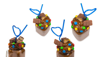 Chocolate milkshake with whipped cream, cookies, waffles, served in glass mason jar. 