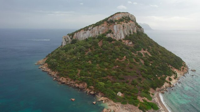 Aerial Splendor: Figarolo, its Azure Waters, and the Graceful Mountain. Island of Sardinia.