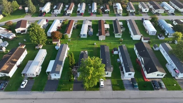 Trailer park in USA. Aerial truck shot above neat mobile homes in America.