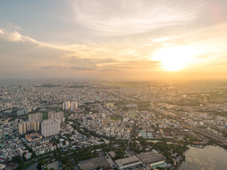 Fototapeta premium Panoramic view of Saigon, Vietnam from above at Ho Chi Minh City's central business district. Cityscape and many buildings, local houses, bridges, rivers