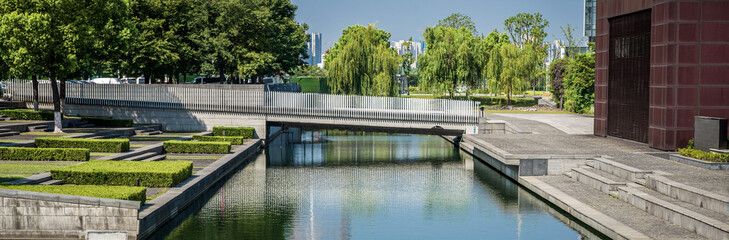 A small bridge over the river in the city park