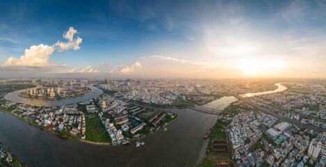 Panoramic view of Saigon, Vietnam from above at Ho Chi Minh City's central business district. Cityscape and many buildings, local houses, bridges, rivers - obrazy, fototapety, plakaty