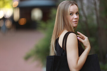 beautiful young woman with makeup with bag