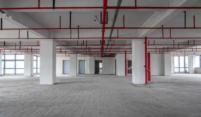 Empty business building building interior, ready for sale renovation, exposed cement