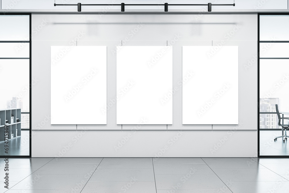 Poster modern office corridor with blank white mock up posters on concrete wall, windows with city view and