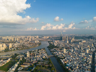 Obraz premium Panoramic view of Saigon, Vietnam from above at Ho Chi Minh City's central business district. Cityscape and many buildings, local houses, bridges, rivers
